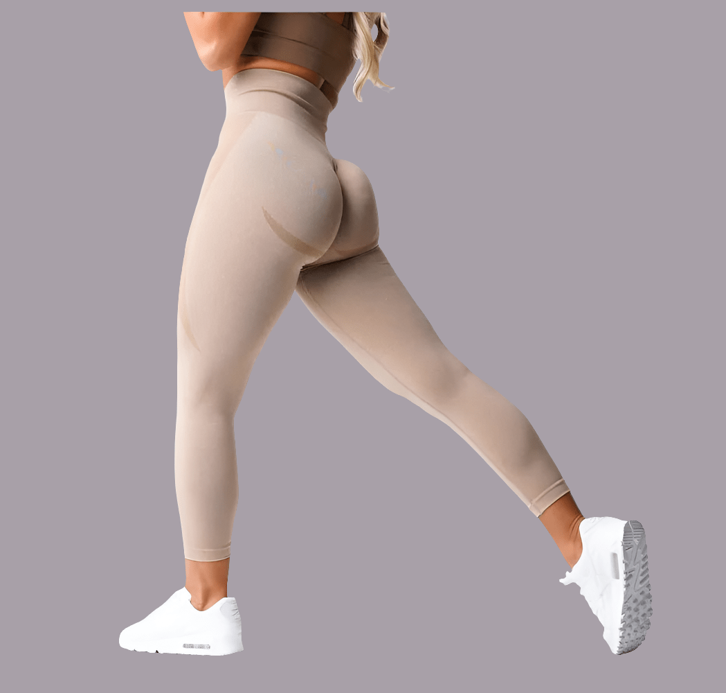 Model wearing Women's seamless leggings while demonstrating their flexibility and style. These leggings for women are suitable for workouts and casual wear, making them an excellent choice for sport leggings yoga pants. Pair with a yoga leggings set for the perfect active look, ensuring comfort and fashion.