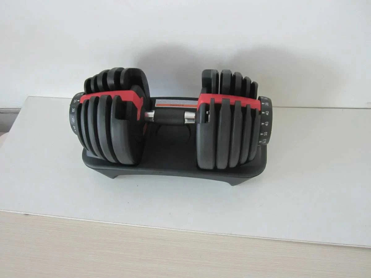 24KG black and red adjustable dumbbell with weight plates on a stand for home fitness workouts