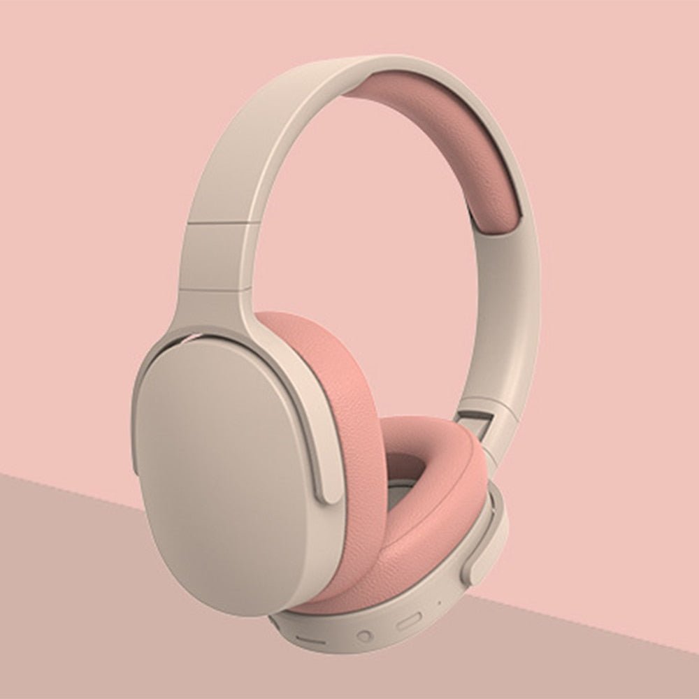 a pair of headphones on a pink background
