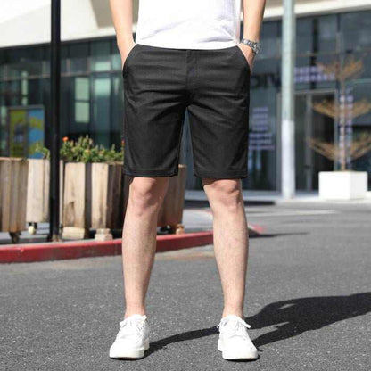 Men's casual black summer pants with elastic waistband, knee-length, styled for comfort and versatility.