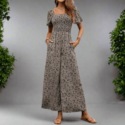 Fashion women's wide-leg pants printed jumpsuit in apricot with high waist and short puff sleeves.