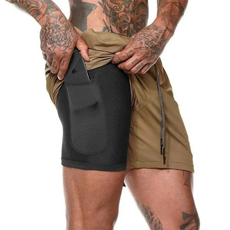 Men's breathable gym shorts with built-in compression layer and side pocket for phone.