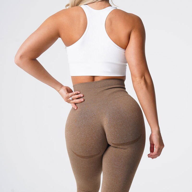 Women's seamless leggings in Mocha color, showcasing a stylish and flexible design for activewear. Perfect for workouts or casual outings, these leggings for women are made with medium thickness fabric. Ideal for yoga enthusiasts looking for leggings yoga pants women, this outfit pairs well with a sport leggings yoga pants or women seamless leggings sports bra ensemble.